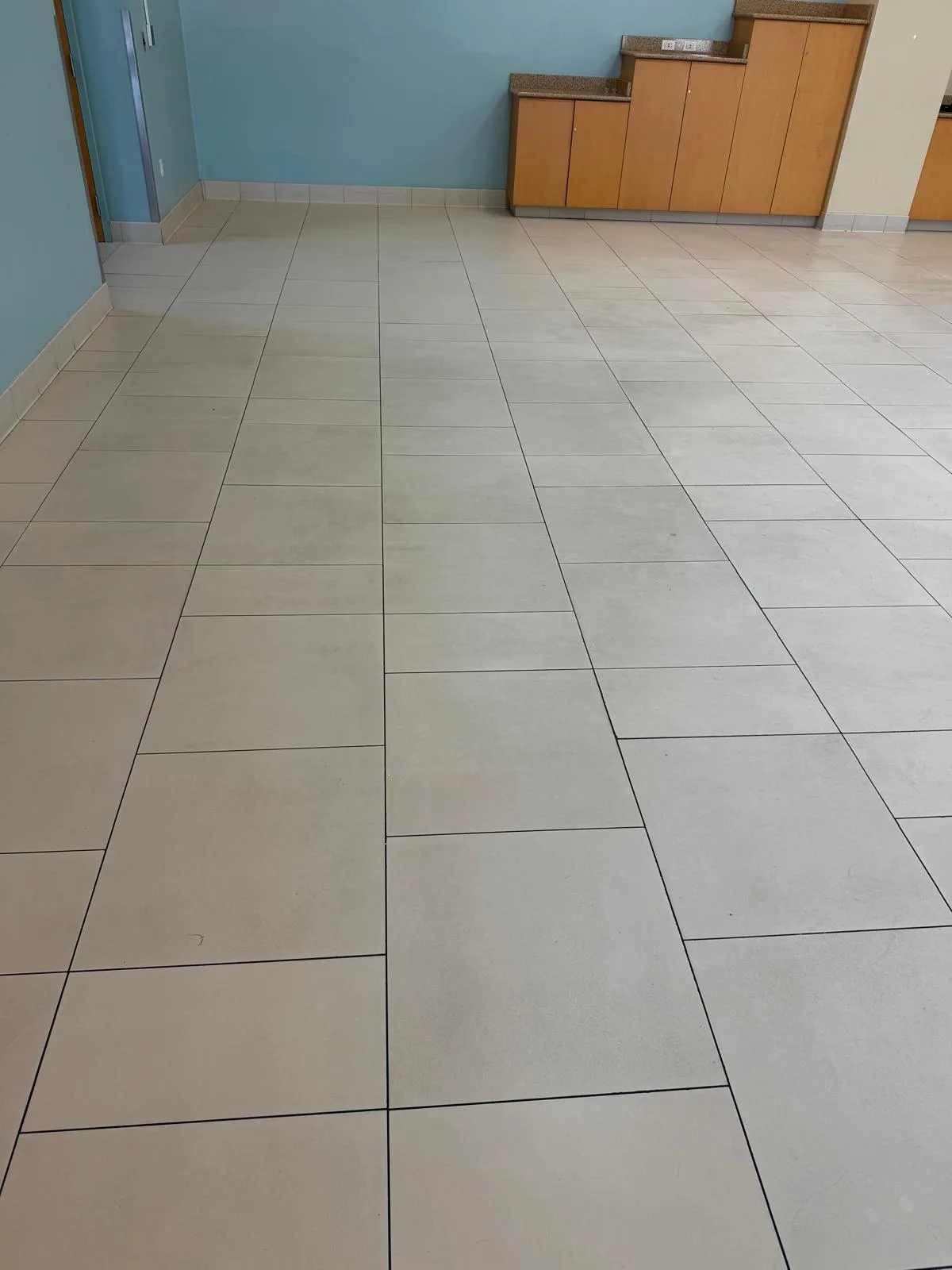 Clean tile floor in a school hallway