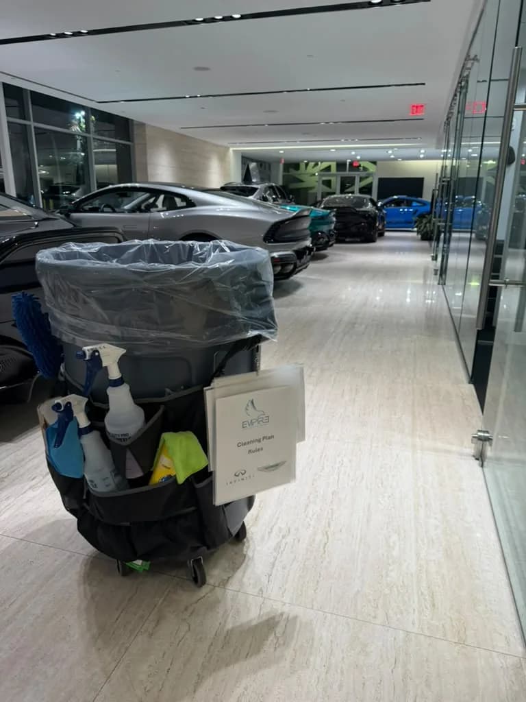 Empire janitorial cart in a dealership hallway